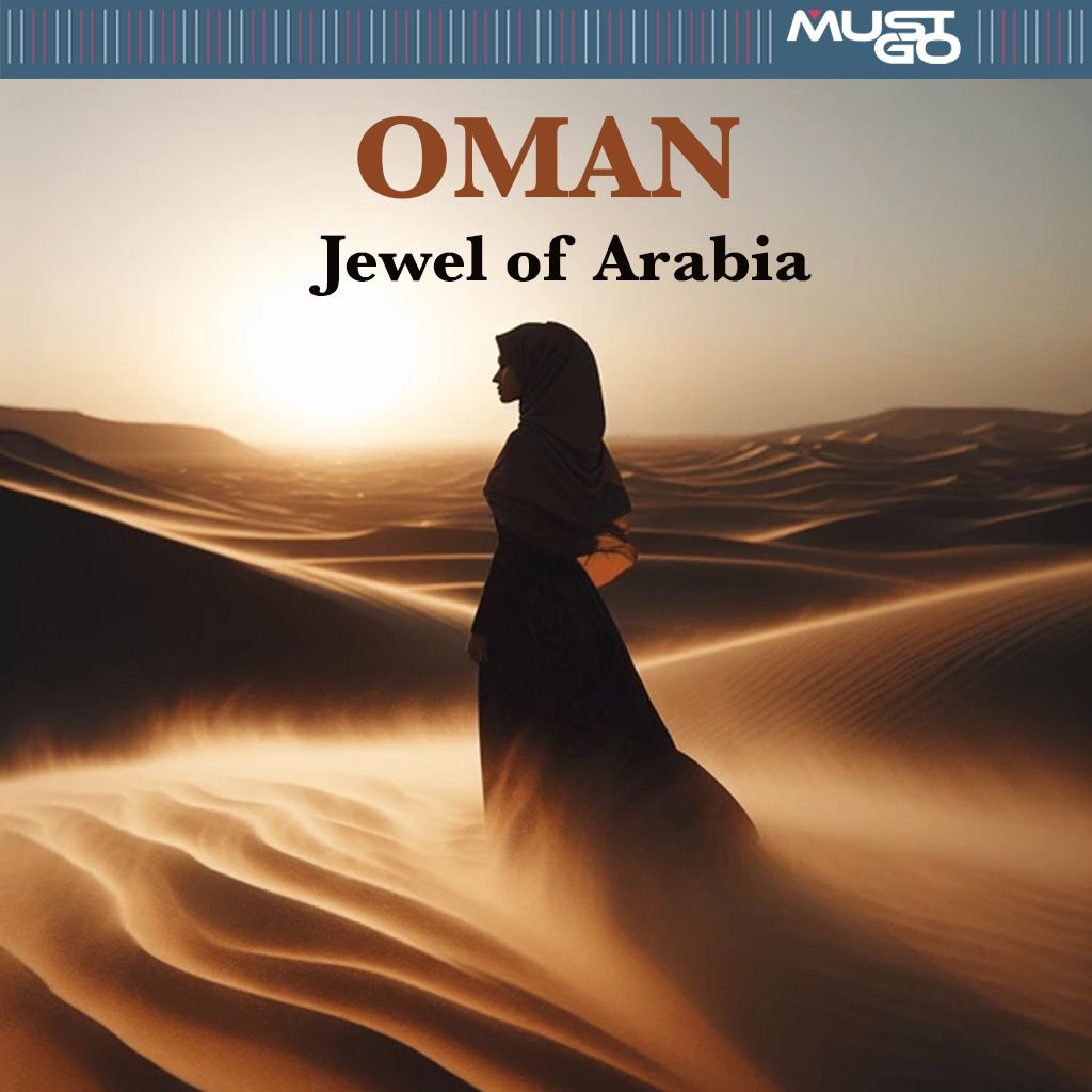A woman in the desert amongst the dunes with sand gently in the air as the breeze passes by with the sun setting in the background.
